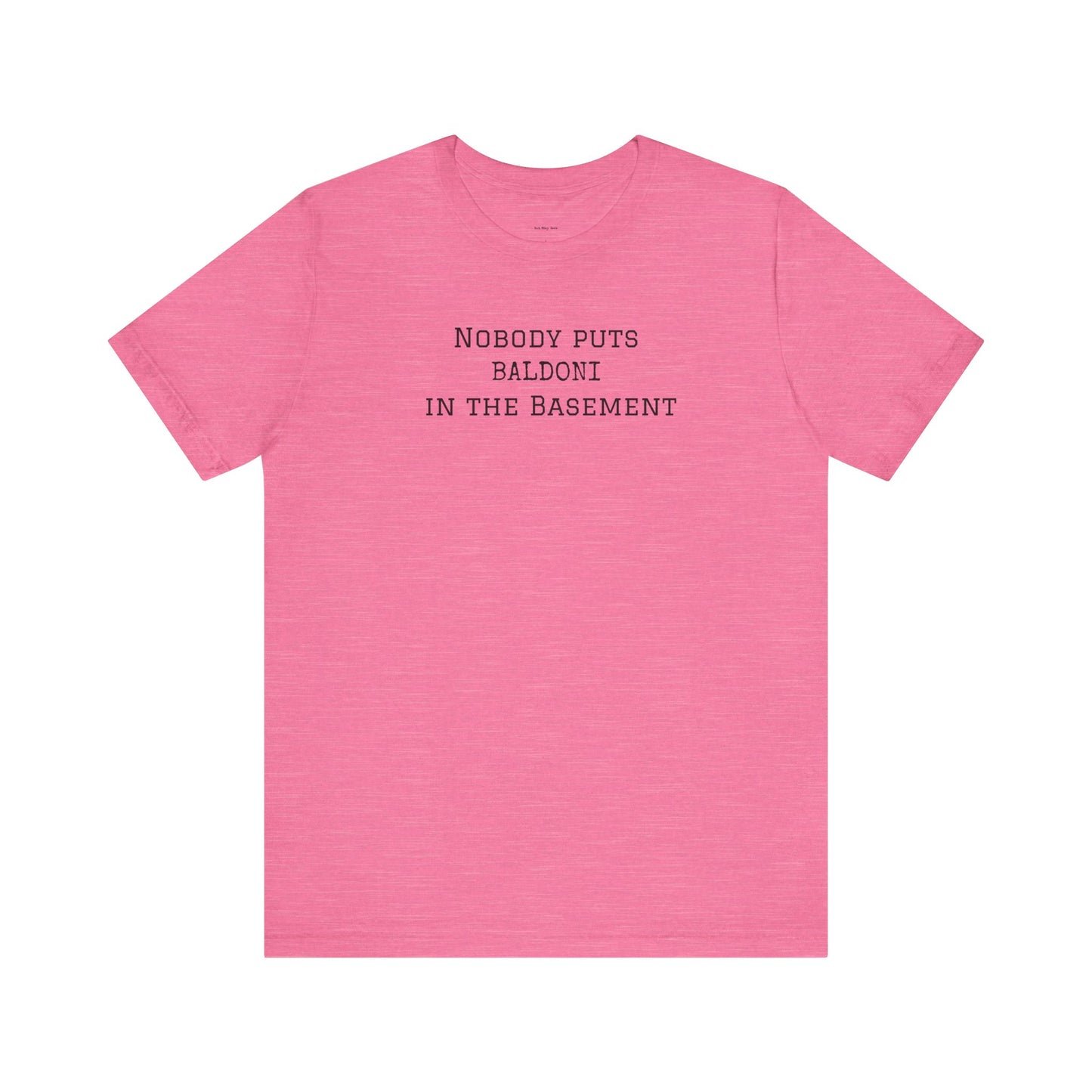 Pink t-shirt with text 'Nobody puts Baldoni in the basement'