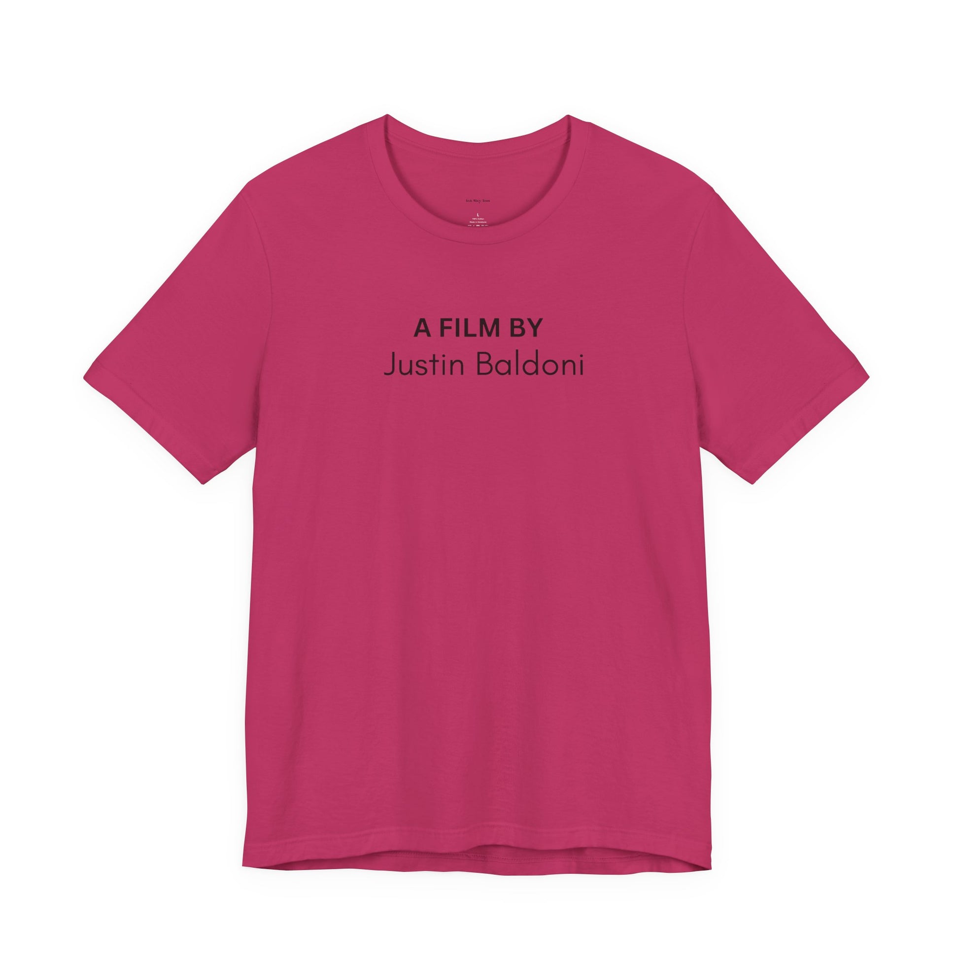 Pink t-shirt with 'A Film by Justin Baldoni' text