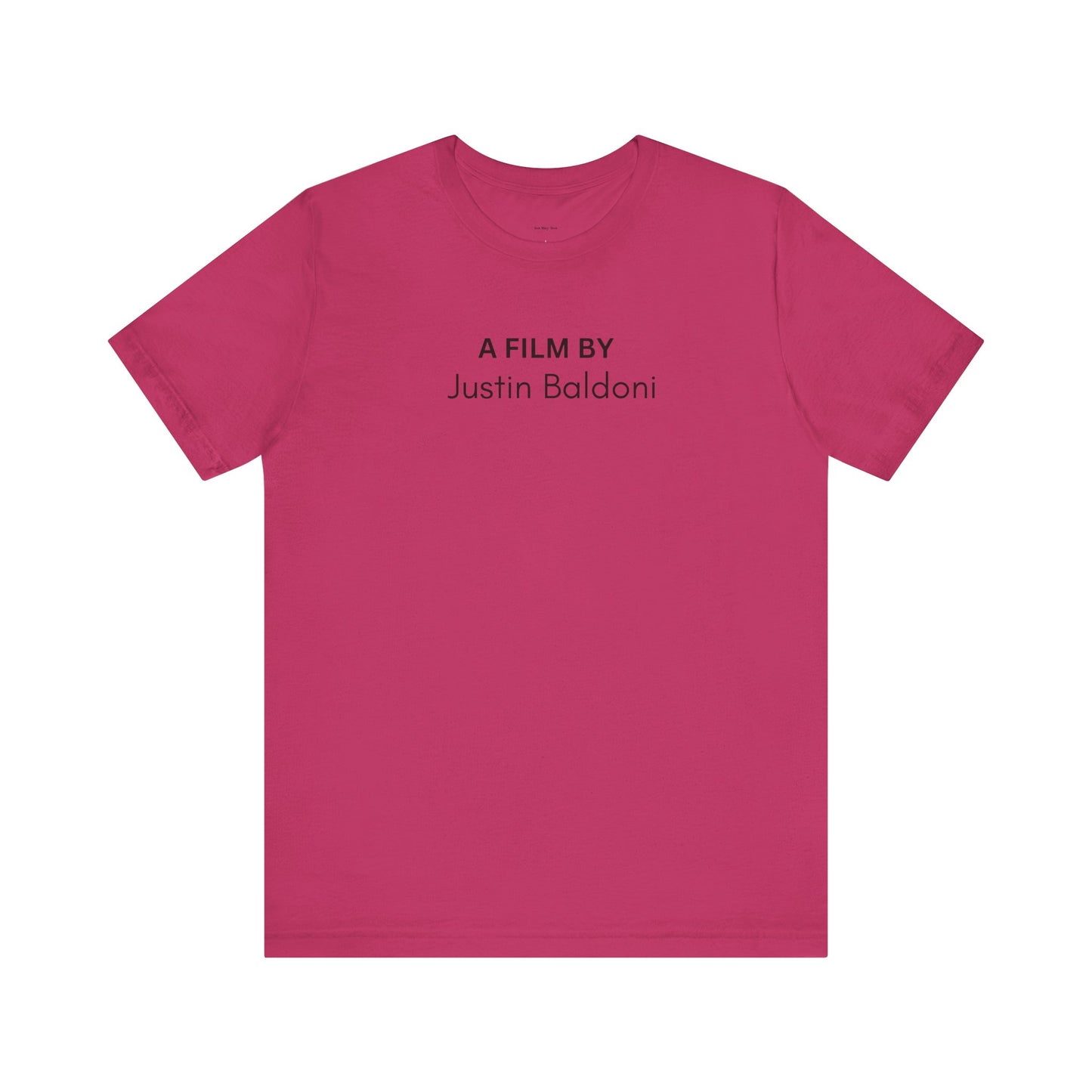 Pink t-shirt with 'A Film By Justin Baldoni' text