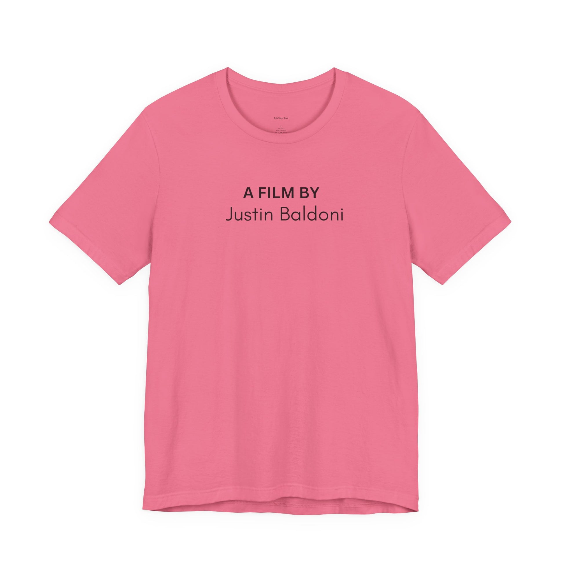 Pink t-shirt with 'A Film by Justin Baldoni' text