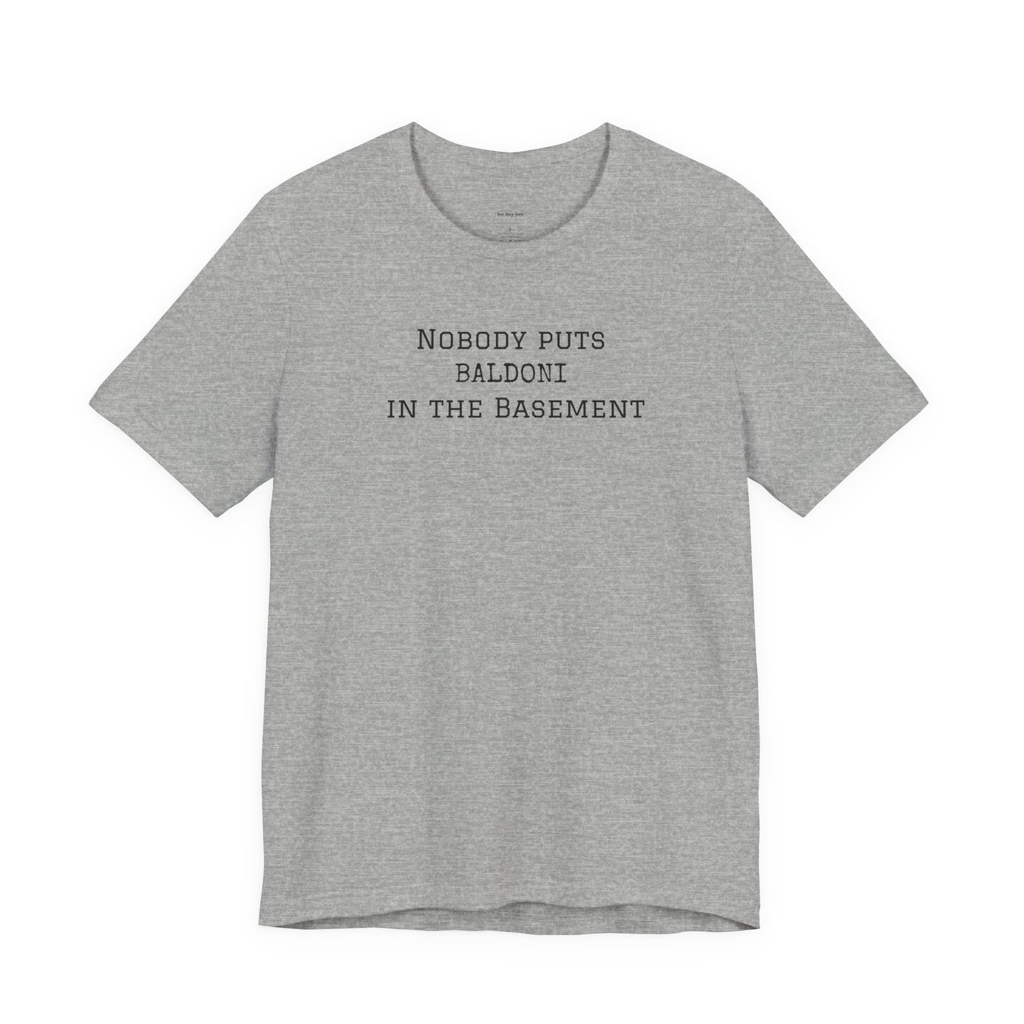 Gray t-shirt with text 'Nobody puts Baldoni in the basement'  