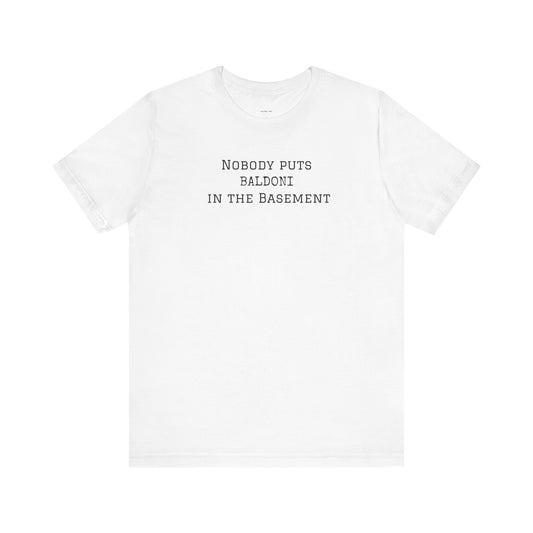 White t-shirt with text 'Nobody puts Baldoni in the basement 
