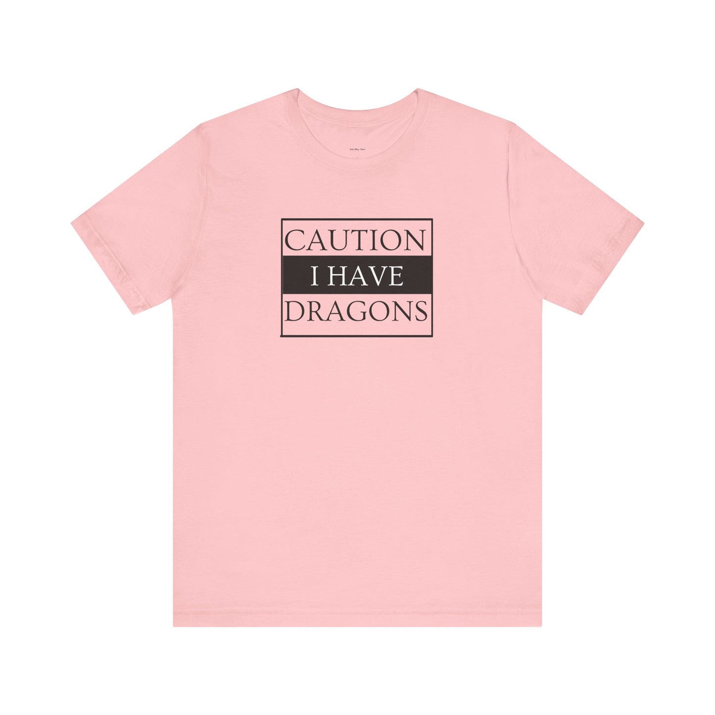 Pink t-shirt with 'Caution I Have Dragons' text  