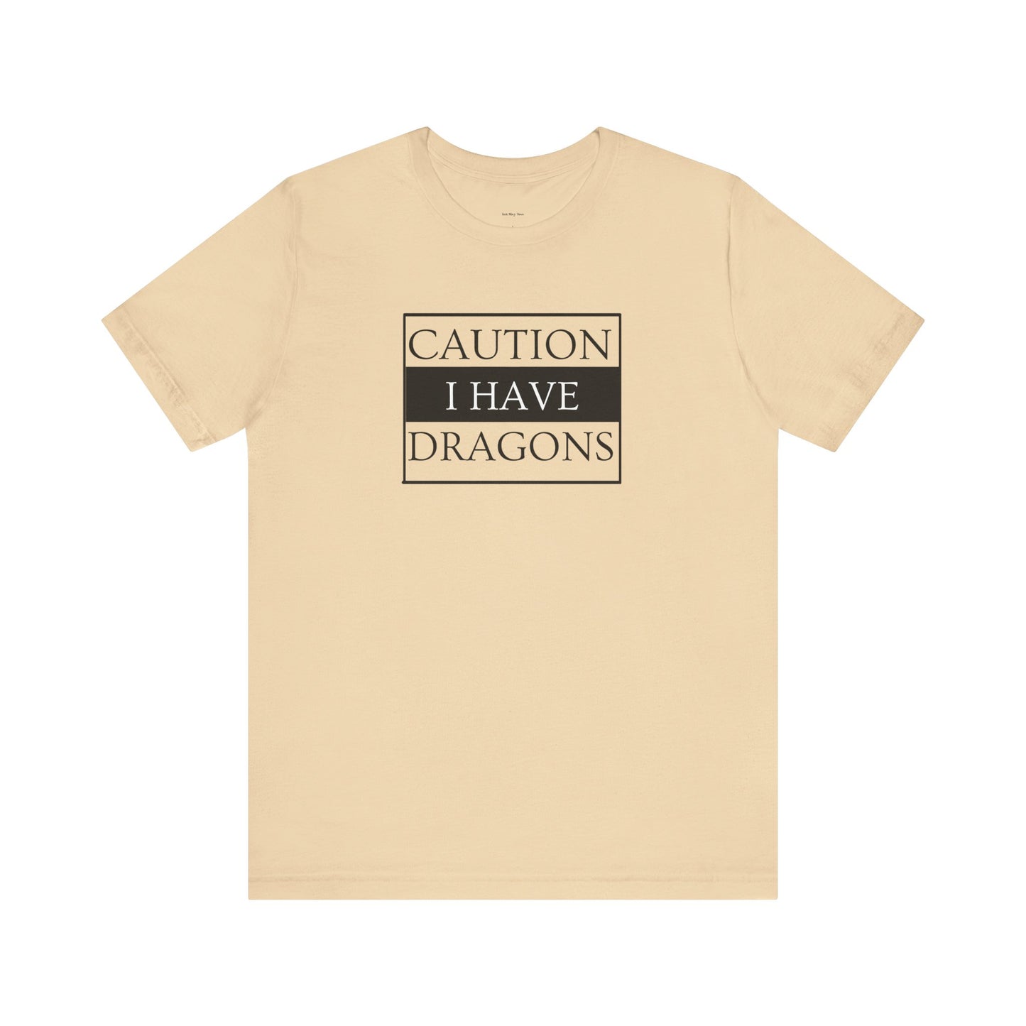 Beige t-shirt with 'Caution: I have dragons' text  